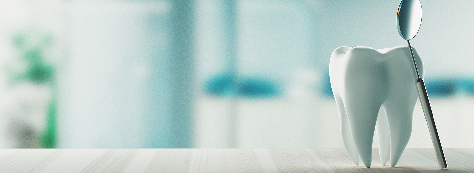 The image shows a dental office setting with a toothbrush in the foreground and a tooth model in the background.